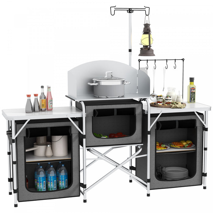 Outsunny Folding Camping Kitchen Table with Storage, Aluminum Portable Camping Table with 3 Fabric Cupboards, Windshield, Light Stand, Carrying Bag for BBQ, RV, Picnic, Grey