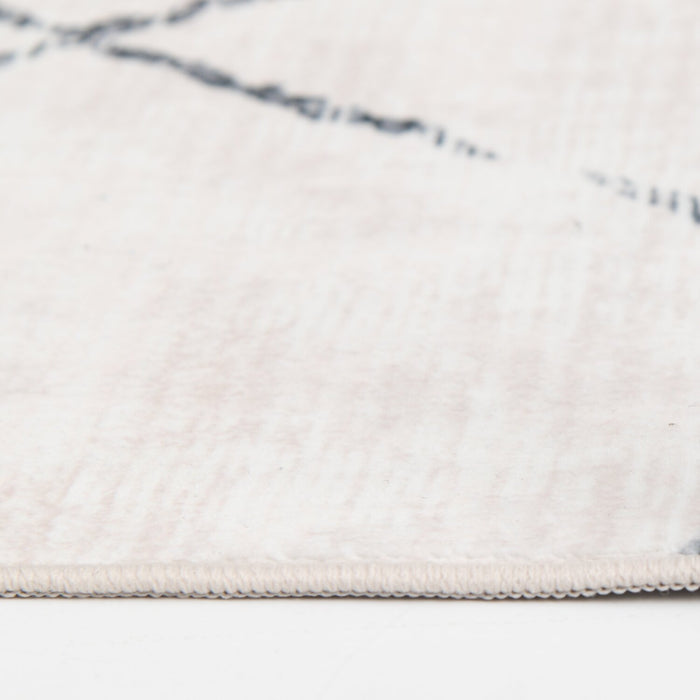 Selin Ivory Washable Area Rug - 5’ x 7’