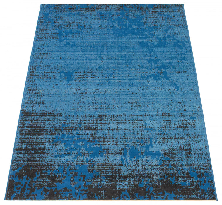 Janaki Blue 6'7\" x 9'6\" Area Rug