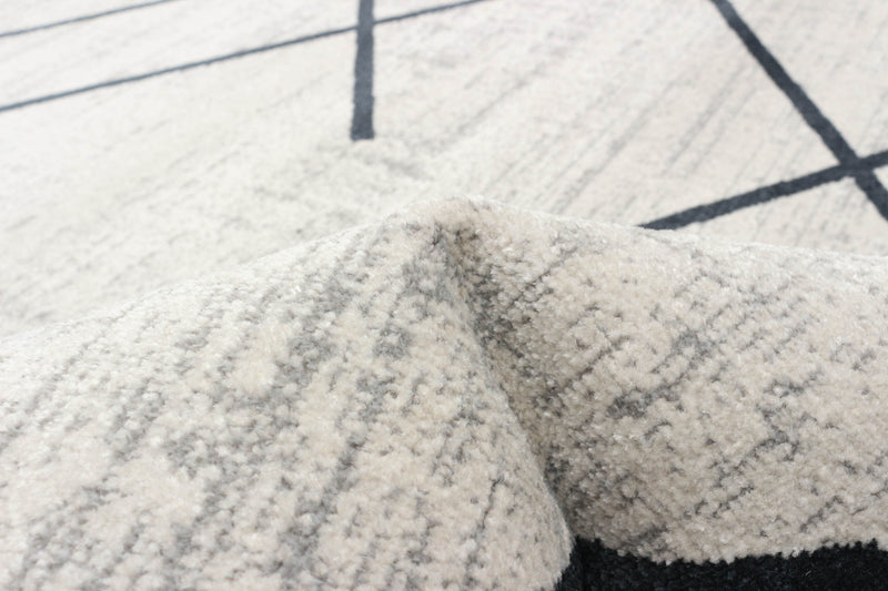 Damali Ivory/Blue Machine Washable Area Rug - 5'0\" x 7'0\"